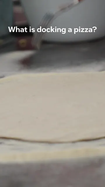 Cover frame of Ooni's pizza dough docking tip video